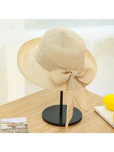 Szerokie brzegowe czapki wiadra czapki 2023 NOWOŚĆ Summer Str Womens Hat Składany brzeg mody Bow Str Hat Women Outdoor Suncreen Beach Str Hat J240429