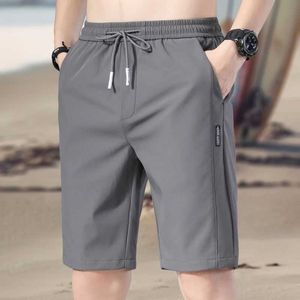 Men's Shorts 1 piece of mens summer silk shorts with thin and breathable cold splicing beach loose elastic waist new sports style Q240427