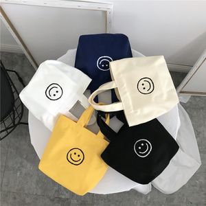 2024 New Smiling Face Canvas Cute Handheld Bag 6 Colors متوفرة لحقائب الظهر بالجملة