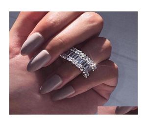 Pierścienie ślubne Przylot luksusowy biżuteria 925 Sterling Sier Fl Princess Cut White Topaz CZ Diamond Pierścień dla kobiet Drop D8535283