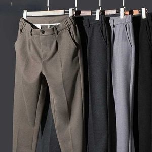 Calça masculina lã de lã de comprimento completo coloração sólida casual simples cintura elástica calça grossa 2023 outono/inverno q240429