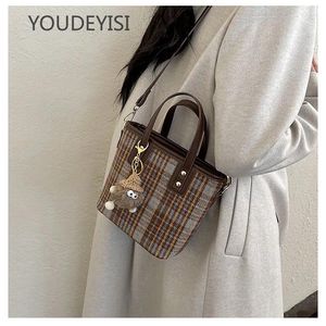حقيبة دلو الرباط youdeyisi الرجعية: حقيبة نسائية واحدة من السيدات أحادية اللون