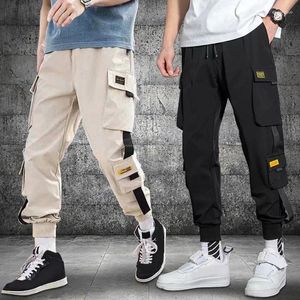 Calça masculina grande capacidade de bolso leggings soltos rabanetes casuais esportes versáteis da moda cortada