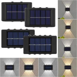 Decorações LED Lâmpada solar Lâmpada ao ar livre à prova d'água para cima e para baixo luzes LED luminosas para a cerca do jardim da varanda Decoração de rua luminárias de parede