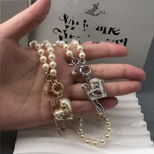 Utsökt högteknologisk version av Light Luxury High-End Personalized Love Pearl Brosch Saturn Armband Halsband