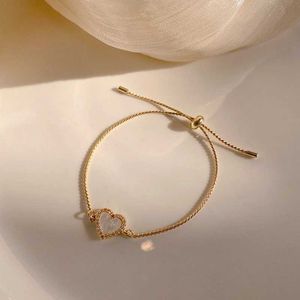 Bracciale a cuore in lega dorata a catena per donne Design semplice Design semplice micro strass per bracciabile festa di gioielli