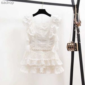 Spódnice 2023 Summer Sexy Hollow Hafted Lace Set Zestaw damski Ruffled krótki rękawowy top+biały mini krótkie rękawy 2-częściowy zestaw xw