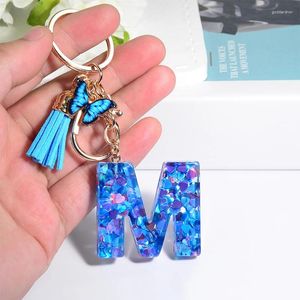 Nyckelringar Crystal A-Z Initialer Nyckelkedja med fjärilsharts Blue Letter Keychain Leather Tassel för kvinnors ryggsäckhänge Keyring