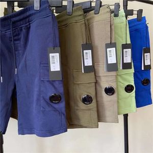 Herr trendiga shorts toptone europeiska och amerikanska casual sport lösa cp byxor modekläder färgade 99
