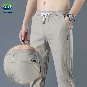 Męskie spodnie oussyu nowe wiosenne/letnie męskie menu swobodne ultra cienkie proste mody Elastyczne khaki jogging 28-38 Q240429