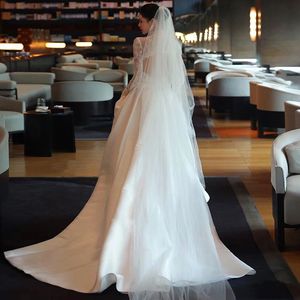 Nuova linea A maniche lunghe Abito da sposa Modesto 2024 corsetto di pizzo Dubai Arabo collo alto raso di lusso Treno Donna Informale Abito da sposa modesto Vestido Abiti da sposa da giardino