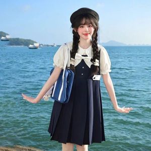 Sukienki swobodne japoński styl college'u kawaii solidny kolor plisowany lolita sukienka Summer Słodka słodka student Student Bow Strap dla kobiet