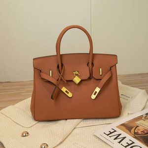 Sacos de desenhista Luxo Moda Totes Premium Bag Togo Top Layer Cowhide Lychee Padrão Único Ombro Cruz Corpo Portátil Luxo Couro Bolsa Feminina O1JX