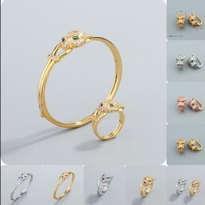 Gult guldpläterat leopard panther huvud gröna onda ögon armband ring örhänge set minimalistiska män kvinnors smycken koppar pläterad guld manschett armband levande sändning