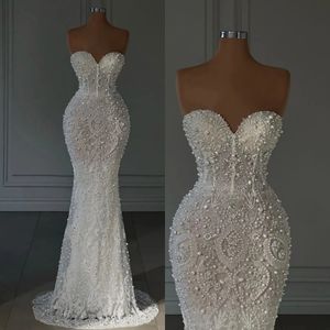 Elegante Perlen Meerjungfrau Brautkleider Trägerloses Hochzeitskleid Applikationen Perlen Maßgeschneiderte Ärmellose Brautkleider Vestido de novia