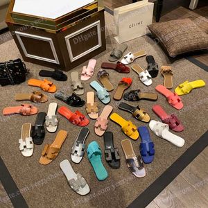 Designer kvinnors tofflor mode lyxig gelé färg läder platt sandaler hotell badrum skor utomhus strandskor avslappnad skosnor i storlek 35-42
