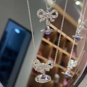 디자이너 Viviane Westwoods Jewelry Viviennr Empress Dowager XI Purple Bow Threedimensional Planet Necklace Classic Saturn Collarbone 체인 INS Small Frag