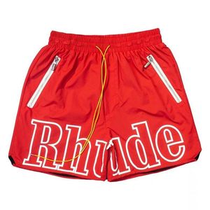 قميص Rhude قصير الأكمام مصمم قمصان رجال شورتات شورتات نساء سروال عرقلة قميص جودة قميص الملابس الصيف فاخرة القطن طباعة قمم الشاطئ على غرار 1W