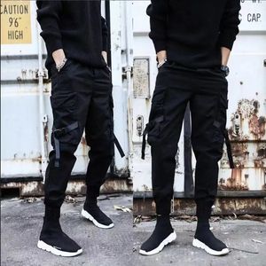 Mężczyźni Spodnie towarowe Wstrząty Kolor Black Pocket Man Harem Joggers HARAJUKU Męskie spodnie dresowe Hip Hop Spodni plus rozmiar 5xl 240124