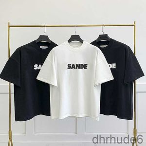 Eur Designer Fashion Classic Jil Sander Shirt Casual Mens Women Letter Printing Couples T Simple Style Loose Short Sleeve Overdimensionerad SQD9