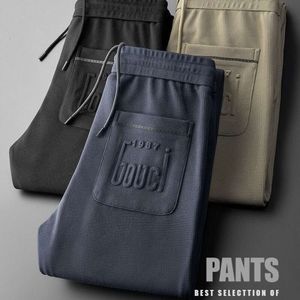 Springowe i jesienne Spodnie strażnicze dla mężczyzn wszechstronne modne modne haftowane stóp sporne spodnie