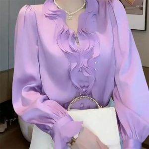 Kvinnors blusar eleganta V-ringning pärlor skarvade rufs kvinnor kläder 2024 Autumn solid color tops fjäril ärmskjortor