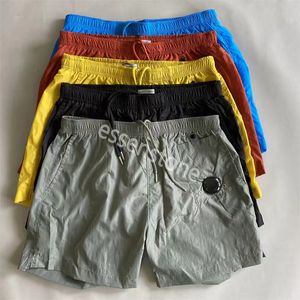 Högkvalitativ designer Enkel linsficka Kort avslappnad färgad strandshorts Simning Shorts utomhus Jogging Casual Quick Torking CP Kort M-2XL