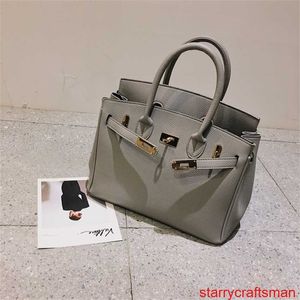 Bolsas de couro genuíno Bolsa de luxo confiável 2024 Novas bolsas femininas moda europeia e americana Litchi Padrão Cachecol Bolsa de platina portátil de um ombro com logotipo HB9J