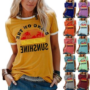 T-shirt a maniche corte girocollo allentata casual con stampa di lettere di albero di cocco per le vacanze da donna