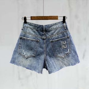 Tidig vår kvinnors shorts modebrev broderi nödställda tvättade denim designer byxor kvinnor blå a-line het