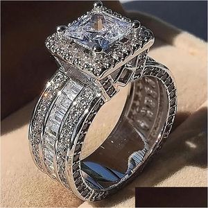 ウェディングリングリングユニークな高級ジュエリープリンセスカットWhie Topaz CZ Diamond Party Eternity Women Wedding Band Ring Gift Drop Otzag