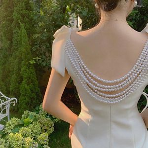 Casual Dresses Pearl Beading Backless Dress Women V-ringen Bow Sleeveless Wedding Party