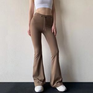 2024 Gli ultimi pantaloni micro yoga da donna a vita alta con pancia tirata fuori per indossare magri e alti senso nudo di sollevamento dell'anca pantaloni sportivi fitness flare