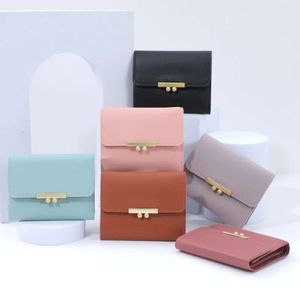 24/5000 New wallet female junior high school students short fashion Korean version hand bag solid color matching money clip