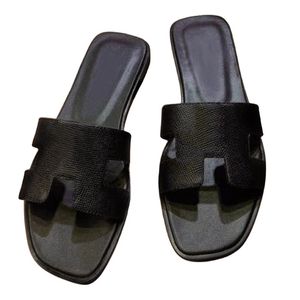 Tofflor ny stil sommar bästa kvalitet designer sandal outwear leisure semester glider strand platt tofflor mode äkta läderskor för kvinnor storlek 34-42