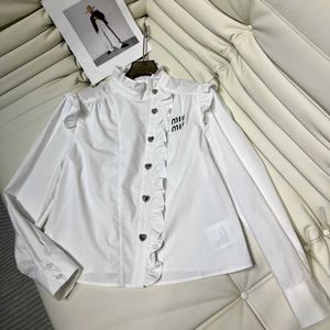 Early Spring New French Ruffle Edge Standing Neck Embroidered Solid Color Light Mature Bubble Sleeve Shirt