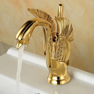 Bathroom Sink Faucets GOld-fashioned Brass Washbasin Faucet Swan-style And Cold Mixer Installed On The Count