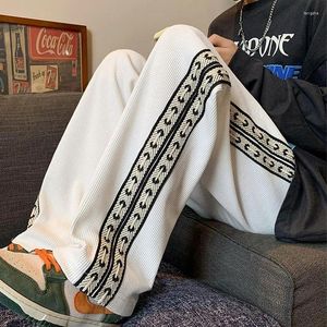 Pantaloni da uomo American High Street Waffle Autunno Casual Uomo Solid Patchwork Stampa Moda alla moda Tasche Pantaloni larghi dritti a gamba larga