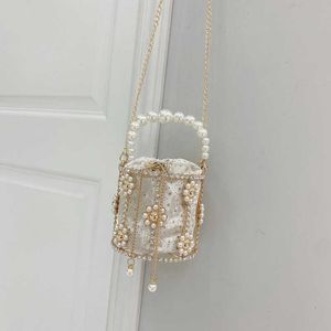 أكياس الكتف French French Rhinestone Pearl حقيبة يد للنساء ذات الطرف الراقي المعدني المجوف من Bird Cage Bag Flower Livaid Diamond Bag 240427