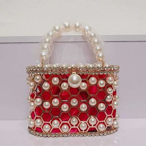 Shoulder Bags Hollow Out Pearl Water Diamond Full Sky Star Bird Cage Bag Dinner Internet Red and Fashionable Handheld Chain Crossbody Women s Premium 240427