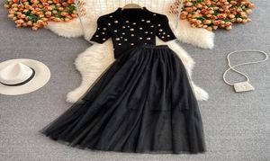 Podyum lüks boncuklu düğme deko siyah iki parçalı elbise kısa kollu kazak örgü maxi etek setleri kadınlar kıyafetler yeni 20226050110