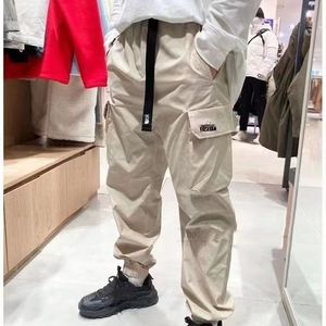 Calças masculinas multi bolsos grandes calças soltas macacão primavera verão marca de moda retro casual treino calças de carga dos homens militares jogging leggings