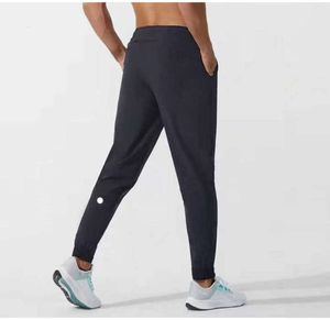 Lulu Men Pants Yogas Strój Longjogger Sport Szybki suchy sznurka do siłowni Pockets Sweatpant Spodni swobodne elastyczne fitness Man Nowe jogging