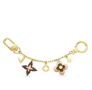 Catena con fiori che sbocciano e M63086 Accessori moda Portachiavi Porta borse TAPAGE Charm Key holders1886316