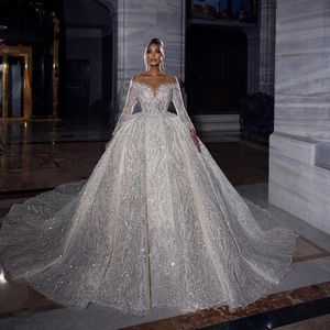 Stunningbride 2024 Abiti da sposa con glitter bianchi scintillanti Abiti da sposa maniche lunghe in pizzo con paillettes fatti a mano con collo trasparente Abito da sposa su misura