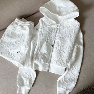 Tracksuit 2 -stycken set kvinnor kläder vår mode mager huva kort jacka och shorts stickad jacquard designer fall kvinnor kläder