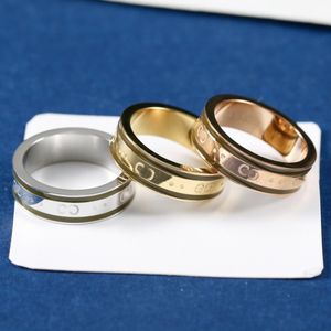 Luxurys designers anéis clássicos homens mulheres titânio aço gravado g carta padrão amantes jóias 18k anel de ouro tamanho 6-9