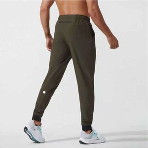 2024 LULULEMENI MAN PANTS Short Yoga Outfit GOGGER Sport Quick Dry Dry Mym Pockets Sweatpants prouts men