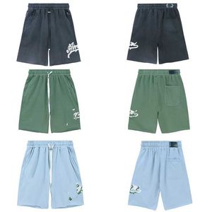 Men's Shorts The new summer mid rise elastic drawstring pants are decorated with zippered pockets on both sides of the waist and back stickers J240530
