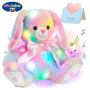 Dockor Shining Cotton Bunny Plush Toys Kasta söta kuddar LED -lampor Musik Rainbow Filled Animals Easter Rabbits As Gifts for Children G240529